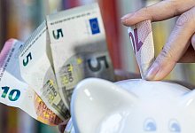 Sparen - Hendrik Schmidt/dpa